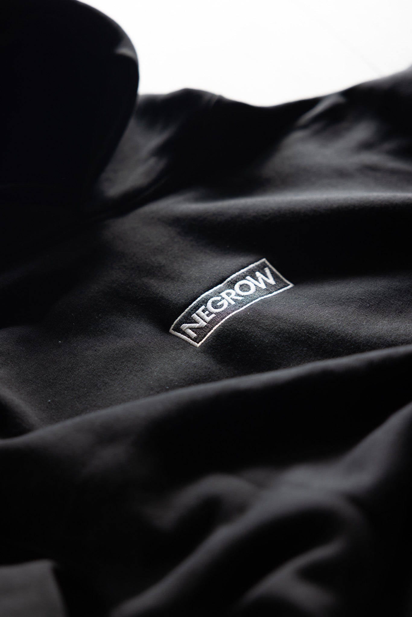 SIGNATURE "NEGROW!™" HOODIE IN BLACK